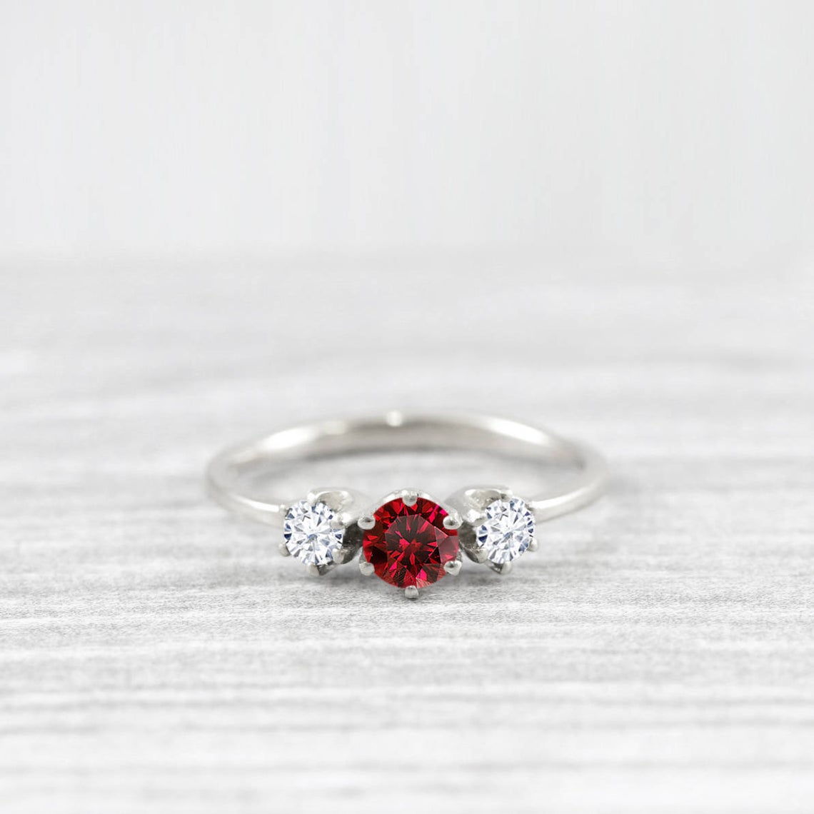 1 Ct Round Cut Red Ruby Diamond Moissanite Trilogy 14K White Gold Finish 3 Stone Promise Ring On 925 Sterling Silver