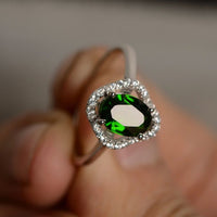 1.50 Ct Oval Cut Green Emerald & Round CZ Halo Engagement Ring In 925 Sterling Silver