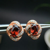 1.20 Ct Oval Cut Red Garnet Rose Gold Plated On 925 Sterling Silver twisted Stud Earring