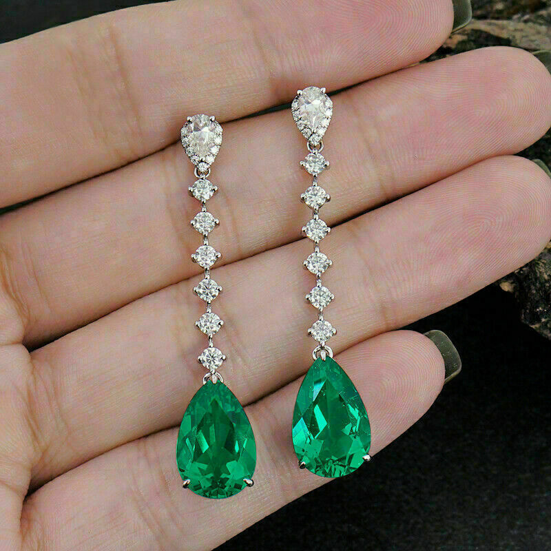 Emerald green drop platinum earrings with cz lining 