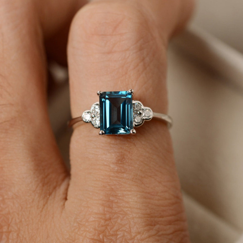 1 CT Emerald Cut London Blue Topaz White Gold Over On 925 Sterling Silver Solitaire W/Accents Ring
