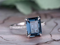 1 CT Emerald Cut London Blue Topaz White Gold Over On 925 Sterling Silver Under Halo Engagement Ring