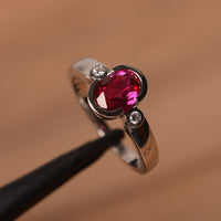 1.50 Ct Oval Cut Ruby Bezel Set Three-Stone Promise Ring In 925 Sterling Silver