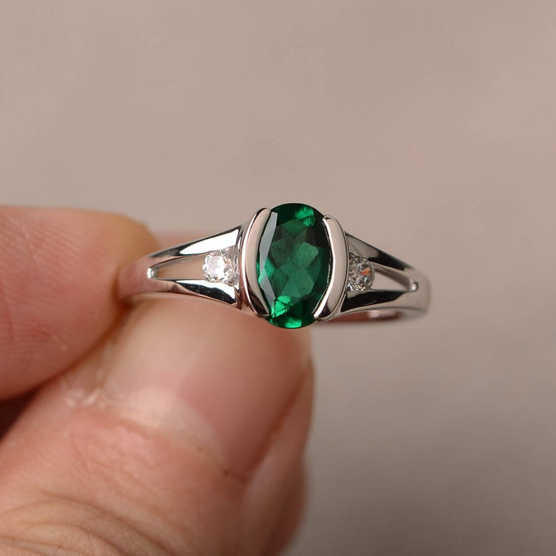 1.20 Ct Oval Cut Green Emerald & Round CZ 925 Sterling Silver Three-Stone Ring