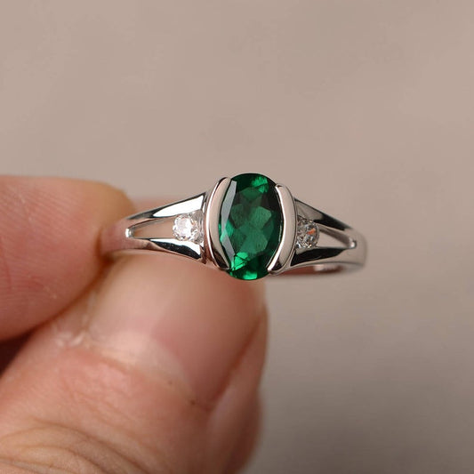 1.20 Ct Oval Cut Green Emerald & Round CZ 925 Sterling Silver Three-Stone Ring