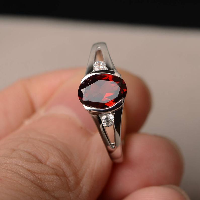 1.25 Ct Oval Cut Red Garnet & Round CZ 925 Sterling Silver Three-Stone Promise Ring