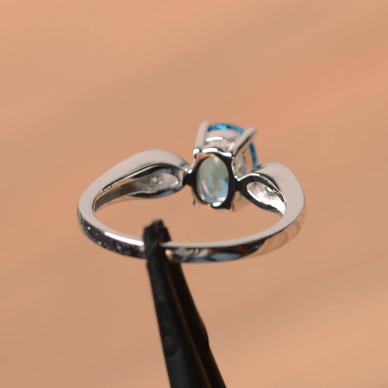 1.20 Ct Oval Cut Blue Topaz & Round CZ 925 Sterling Silver Three-Stone Promise Ring