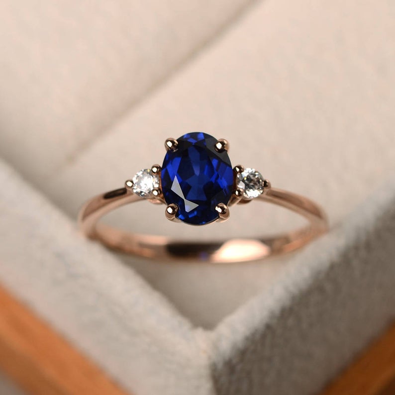 1.50 Ct Oval Cut Blue Sapphire & Round CZ Three-Stone Promise Ring In 925 Sterling Silver - atjewels.in