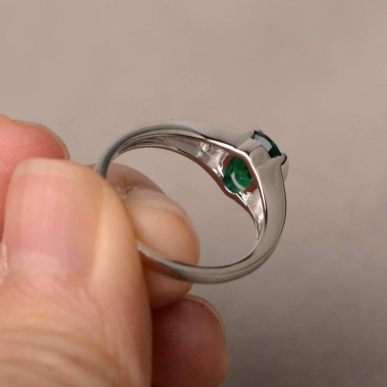 1.20 Ct Oval Cut Green Emerald & Round CZ 925 Sterling Silver Three-Stone Ring