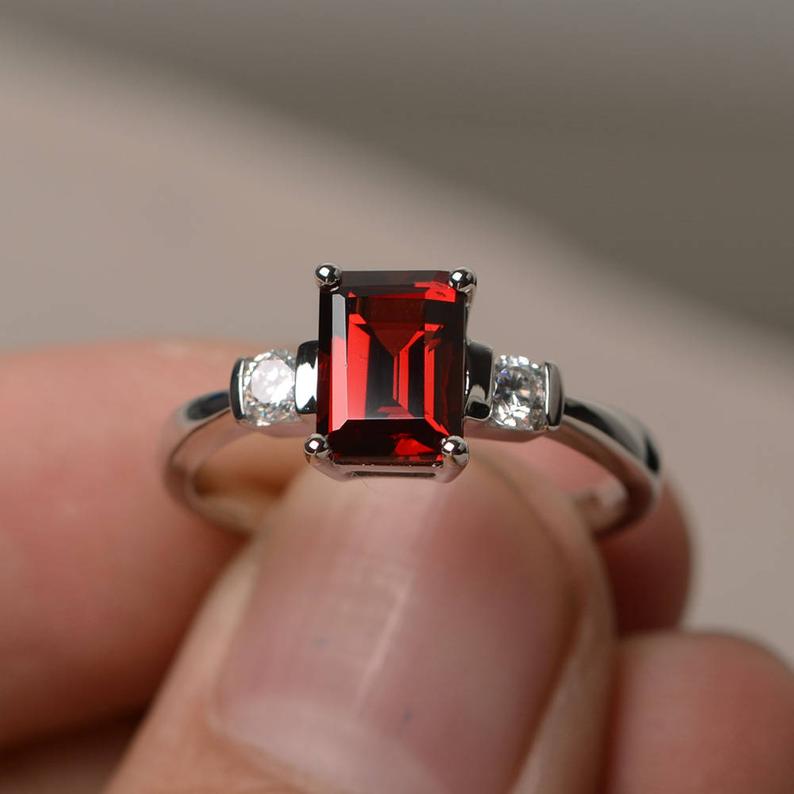1.50 Ct Emerald Cut Red Garnet & Round CZ 925 Sterling Silver Three-Stone Promise Ring