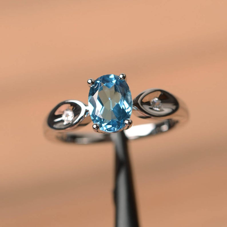 1.20 Ct Oval Cut Blue Topaz & Round CZ 925 Sterling Silver Three-Stone Promise Ring