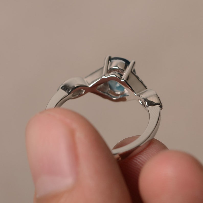 1.20 Ct Oval Cut London Blue Topaz 925 Sterling Silver Infinity Engagement Ring