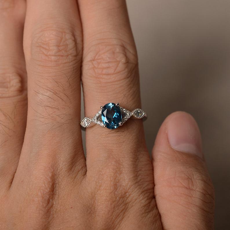1.20 Ct Oval Cut London Blue Topaz 925 Sterling Silver Infinity Engagement Ring
