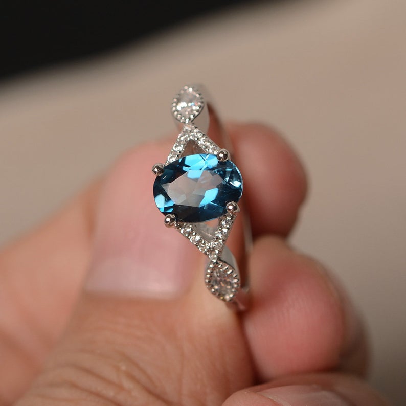 1.20 Ct Oval Cut London Blue Topaz 925 Sterling Silver Infinity Engagement Ring