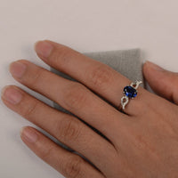 1.30 CT Oval Cut Blue Sapphire 925 Sterling Silver Angle Wings September Birthstone Ring