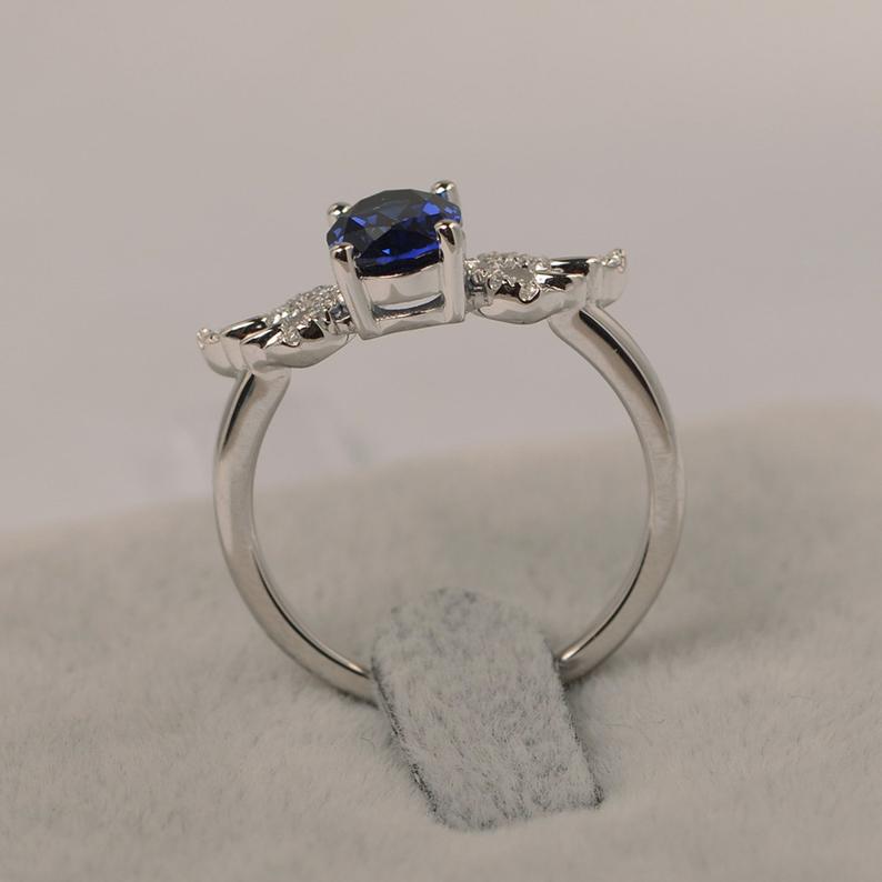 1.30 CT Oval Cut Blue Sapphire 925 Sterling Silver Angle Wings September Birthstone Ring