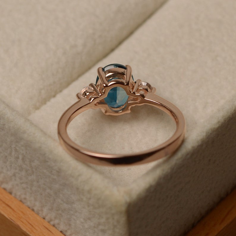 1.20 Ct Oval Cut London Blue Topaz Rose Gold Over On 925 Sterling Silver Three-Stone Promise Ring