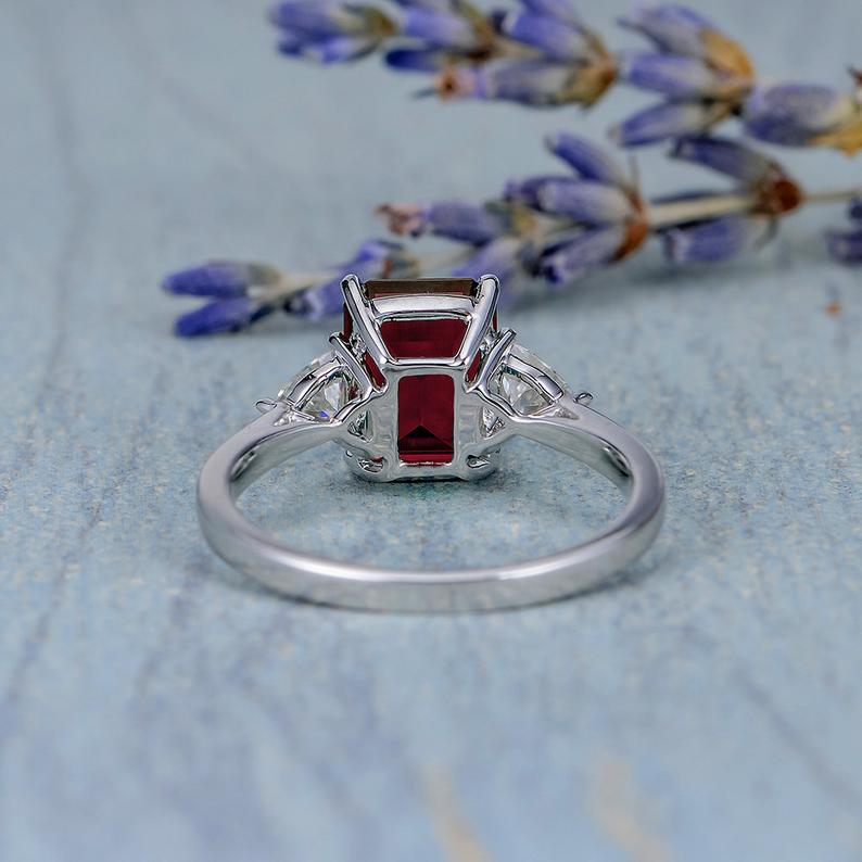 2.00 Ct Emerald Cut Red Garnet & Trillion Cut White CZ Three-Stone Promise Ring In 925 Sterling Silver
