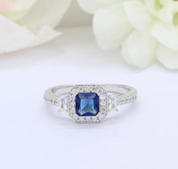 1 CT Cushion Cut Blue Sapphire & Round Baguette CZ Halo Engagement Ring