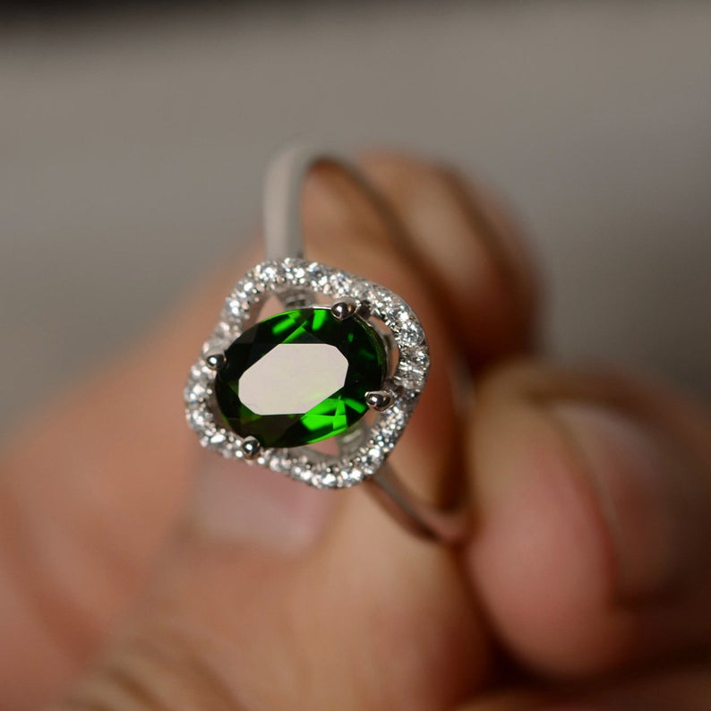 1.50 Ct Oval Cut Green Emerald & Round CZ Halo Engagement Ring In 925 Sterling Silver