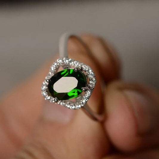 1.50 Ct Oval Cut Green Emerald & Round CZ Halo Engagement Ring In 925 Sterling Silver