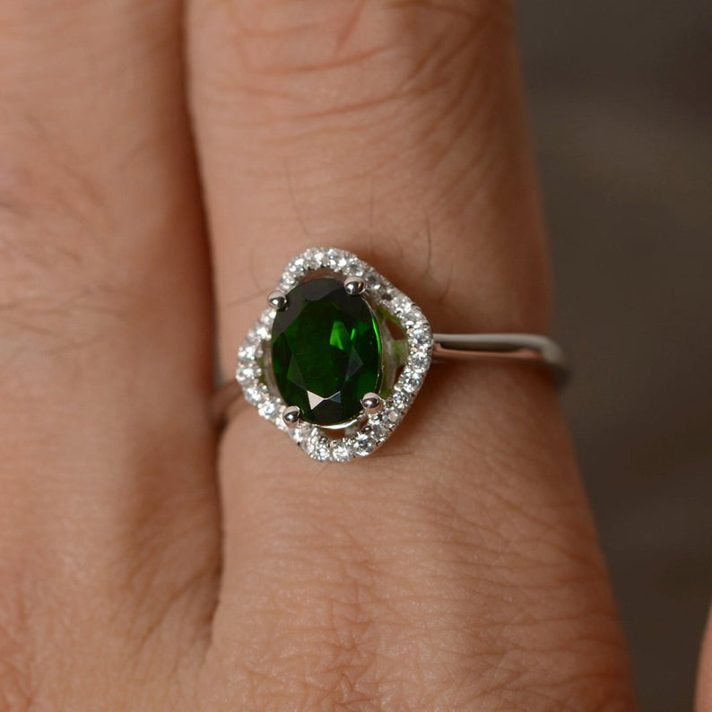 1.50 Ct Oval Cut Green Emerald & Round CZ Halo Engagement Ring In 925 Sterling Silver